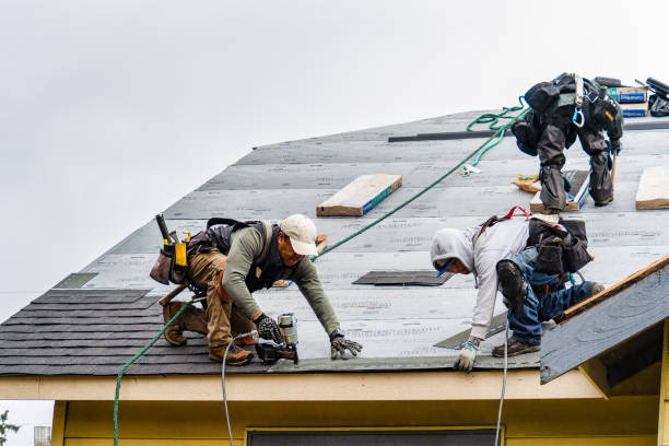 Professional Gutter Installation technician working in Somerville, MA